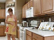 Anilos housewife cooks in her apron with nothing underneath