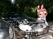 Busty babes washing car outdoors